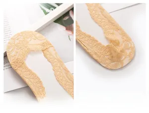 Detailed close-up showing the intricate floral lace texture and beige non-slip cotton sole