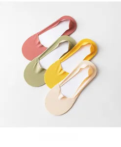Detail of four seamless ice silk invisible socks in pastel colors with anti-slip design
