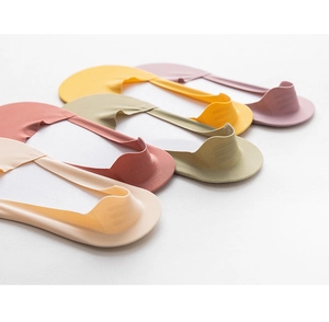 Detail view of colorful low cut socks featuring non-slip silicone heel design