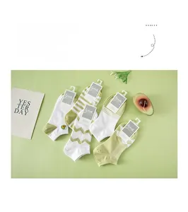 Set of five avocado green women's low cut cotton socks with various fresh patterns