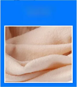 Close-up of beige cooling ice silk fabric texture showing breathable sunscreen structure