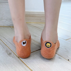 Cute orange low-cut liner socks for women with cartoon teddy bear embroidery detail
