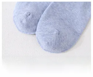 Close-up of seamless light blue cotton sock toe featuring smooth flat stitching detail