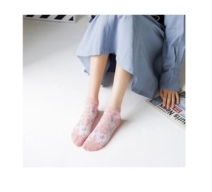 Close-up of pink floral mesh boat socks with 3D flower detail and reinforced toe