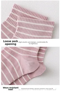 Detail of high-elasticity ribbed cuff and reinforced heel on pink striped cotton socks