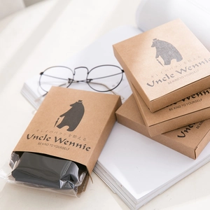 Sheer velvet pantyhose in stylish kraft paper box packaging with elegant bear logo