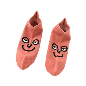 Coral low-cut cotton socks featuring a minimalist funny face design for couples