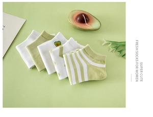 Flat lay of five pairs of green avocado-themed cotton low-cut socks for women