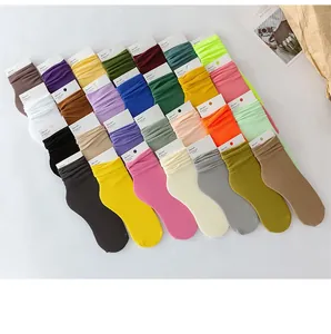 Macro detail of multi-color ribbed crew socks in a variety of vibrant spring summer tones