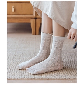 Detailed view of white breathable ice silk mesh socks with elegant ruffled lace edges