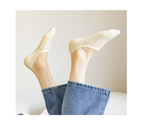 Detail view of beige breathable mesh low cut socks for women showing invisible design