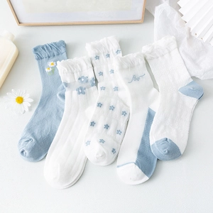 Five pairs of floral cotton mid-calf socks with ruffle cuffs and daisy embroidery
