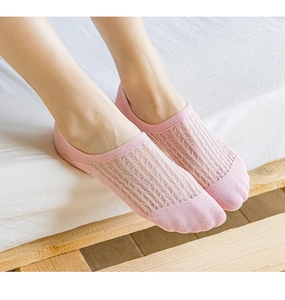 Detail of pink mesh no-show socks with breathable hollow stripes and elastic cuff