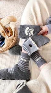 Detail of wool socks with egg label, stripe pattern, and cute bow tie decoration