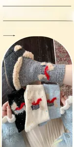 Detail of wool-like knit crew socks with cute scarf puppy embroidery and soft texture
