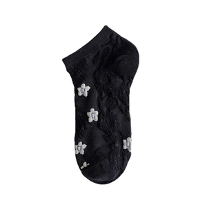 Black mesh boat socks for women featuring white floral embroidery and jacquard texture