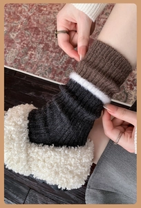 Close-up of thick knit wool socks in brown and grey stripes with warm fleece boots