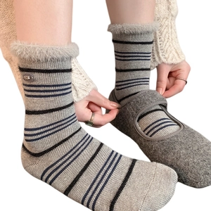 Women's warm striped socks with plush fur trim and metal buckle detail for winter
