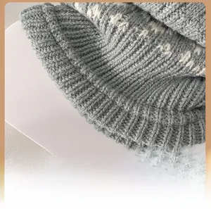 Close-up of vintage Fair Isle leg warmers showing thick grey knit texture and ribbed heel