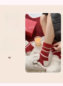 Detailed texture of red and white striped cashmere socks with elastic ribbed cuffs