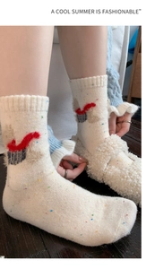 Detail of wool blend confetti socks featuring a cute puppy motif and colorful speckles