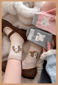 Close-up of thick wool crew socks with cute cartoon dog embroidery and ribbed cuffs
