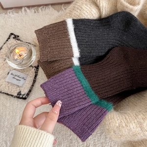 Thick ribbed wool socks in color-block designs with cozy stripes for winter warmth