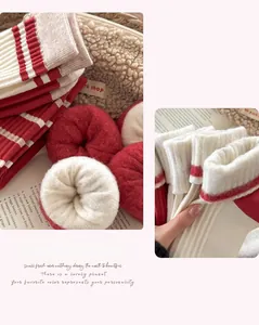 Detail of thick striped cashmere socks with cozy knitted texture for winter warmth