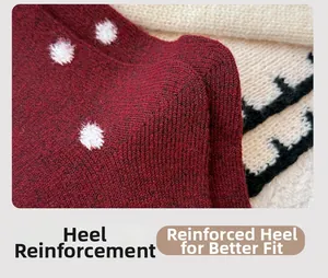 Close-up of deep red wool socks with reinforced heel and white polka dot texture