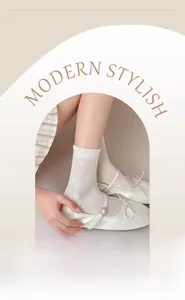 Close-up of white mesh silk socks featuring heart patterns and breathable eyelet texture