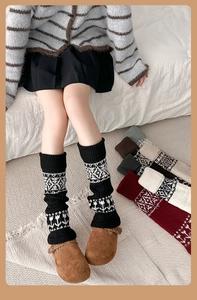 Close-up of Fair Isle knit leg warmers showing bohemian patterns and ribbed texture
