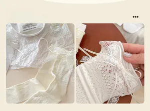 Detail of white crochet mesh socks featuring elegant lace bows and scalloped edges