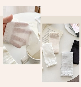 Detail of breathable heart jacquard mesh socks with elegant ruffle cuffs for women