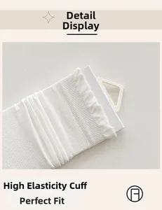 Detail showing the high-elastic ribbed cuffs of white silk socks with mesh texture