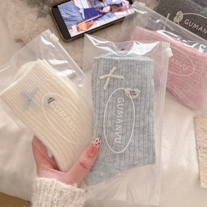 Cozy wool crew socks set with sweet bow details in various soft pastel colors