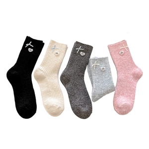 Five pairs of warm wool blend crew socks with sweet bows and heart charms in multiple colors