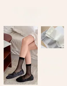 Detail showing sheer vertical striped crew socks in black and grey with mesh texture