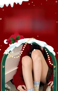 Detail of Christmas themed cotton socks paired with a festive red cardigan and skirt