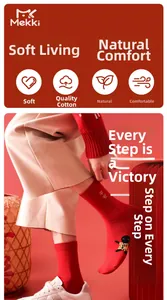 Detailed view of red cotton sock featuring peace embroidery and a creative cartoon sole