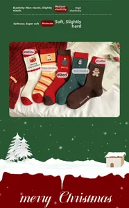 Detail of five festive Christmas combed cotton socks with holiday embroidery patterns