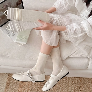 Elegant off-white hollowed bow crew socks with delicate knitted texture and silk touch
