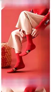 Detail of red cotton socks featuring Ping'an embroidery and festive Chinese New Year patterns