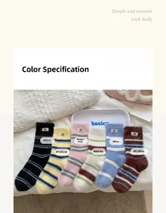 Close-up of thick striped mink velvet socks set in six cozy colors on white tray