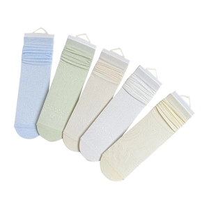 Five pairs of hollow-out bow mesh crew socks in pastel colors for women's spring fashion
