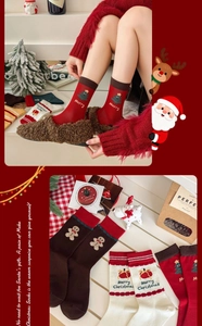 Close-up of festive Christmas cotton socks featuring gingerbread man and tree embroidery