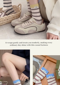 Detail of striped cotton crew socks with 'sweet!!' label worn with vintage sneakers