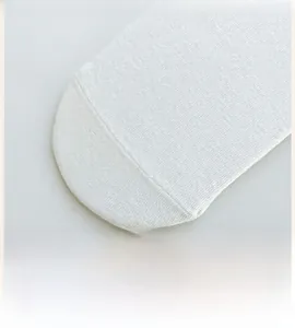 Close-up of seamless toe stitching on white cotton crew socks for women