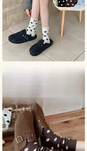 Detail of plush winter socks with polka dots paired with cozy mule slippers in home setting