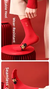 Detail of red festive socks showing reinforced heel and seamless toe with Pingan embroidery