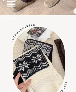 Detail of vintage Fair Isle leg warmers with snowflake patterns and thick knit texture